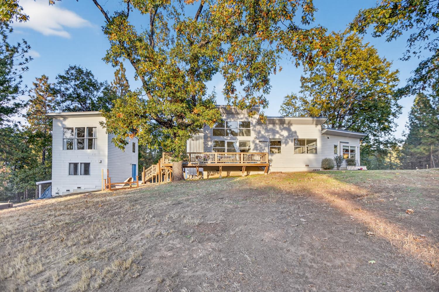 22080 Fiddletown Road Volcano, CA 95689 - Photo 77 of 94 a view of a house with a large tree and a yard