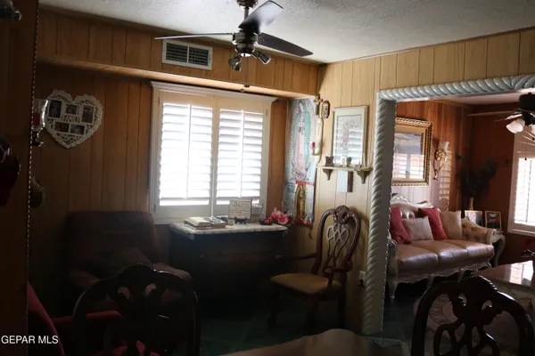a dining room with furniture and window