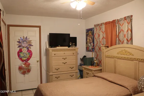 a bedroom with a bed and furniture