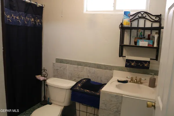a bathroom with a toilet and a sink