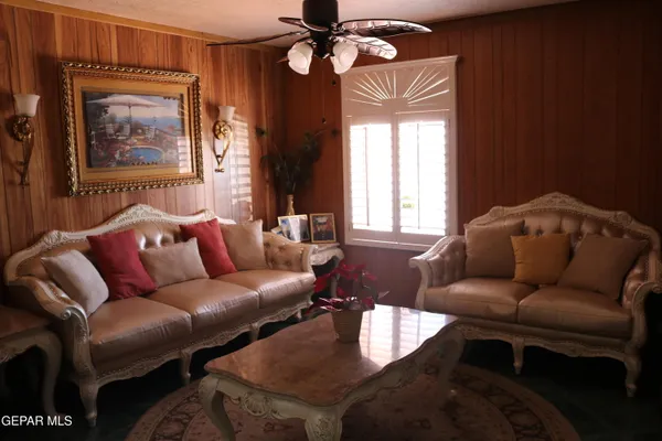 a living room with furniture and a window