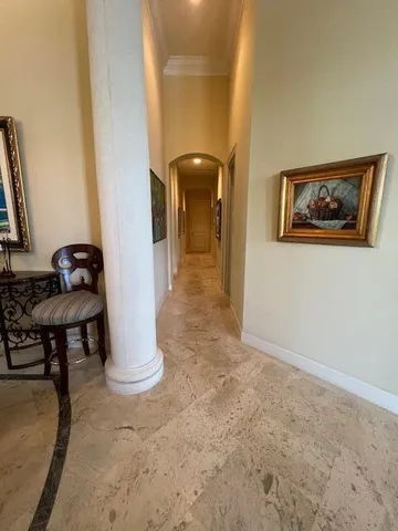 a view of a hallway with seating area