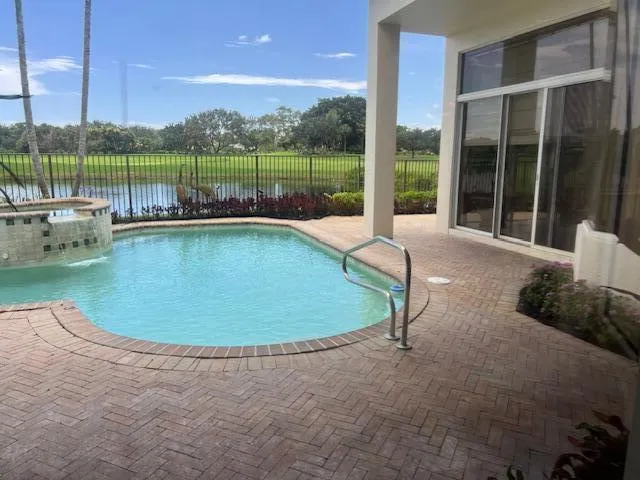 a view of a swimming pool with a patio
