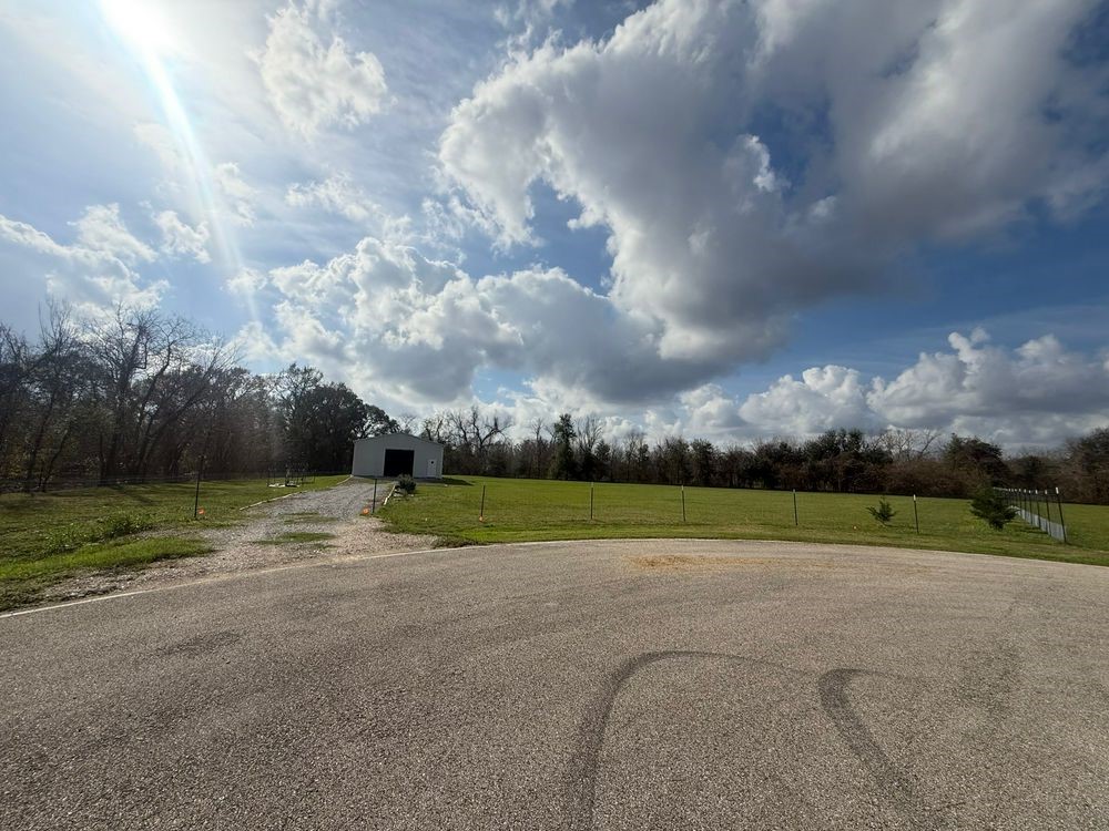 4527 Star Lake Lane Rosharon, TX 77583 - Photo 4 of 8 a view of a field and trees in the background