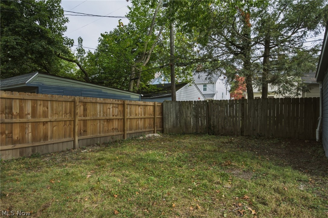 1173 Yellowstone Road Cleveland Heights, OH 44121 - Photo 38 of 44 Fenced backyard with wood privacy fencing and a grass lawn