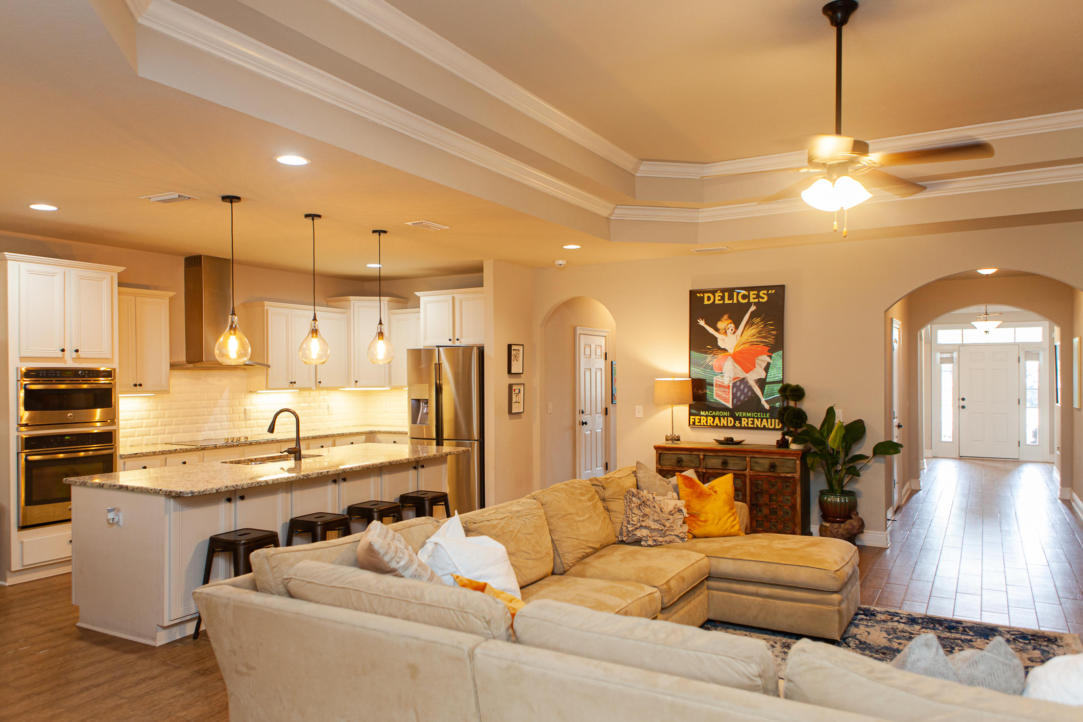 107 Maddox Street Santa Rosa Beach, FL 32459 - Photo 24 of 37 a living room with stainless steel appliances kitchen island granite countertop furniture and a view of kitchen