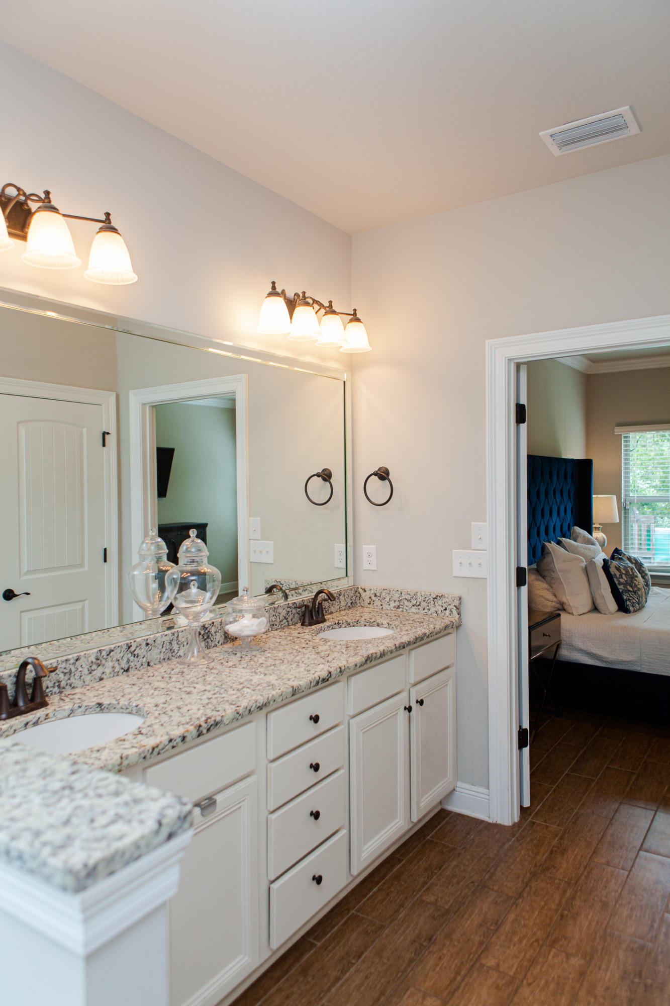 107 Maddox Street Santa Rosa Beach, FL 32459 - Photo 27 of 37 a en suite bathroom with a granite countertop sink and a mirror