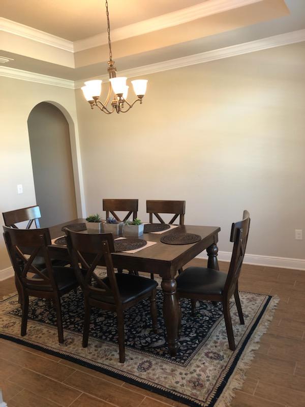107 Maddox Street Santa Rosa Beach, FL 32459 - Photo 10 of 37 a view of a dining room with furniture and wooden floor