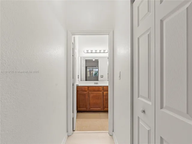 a en suite bathroom with a sink and a mirror