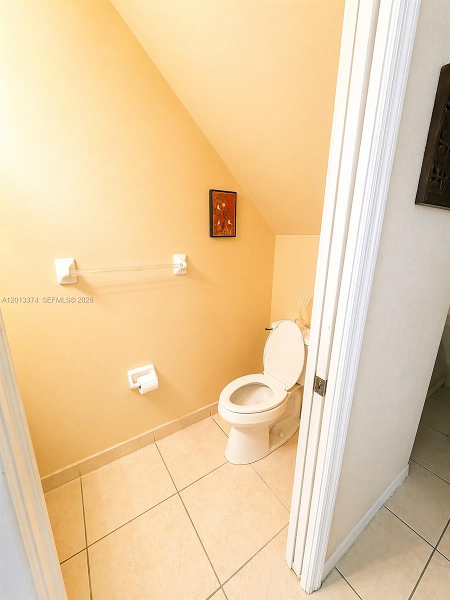 993 Northeast 3rd Avenue Homestead, FL 33030 - Photo 14 of 16 a bathroom with a toilet and a shower