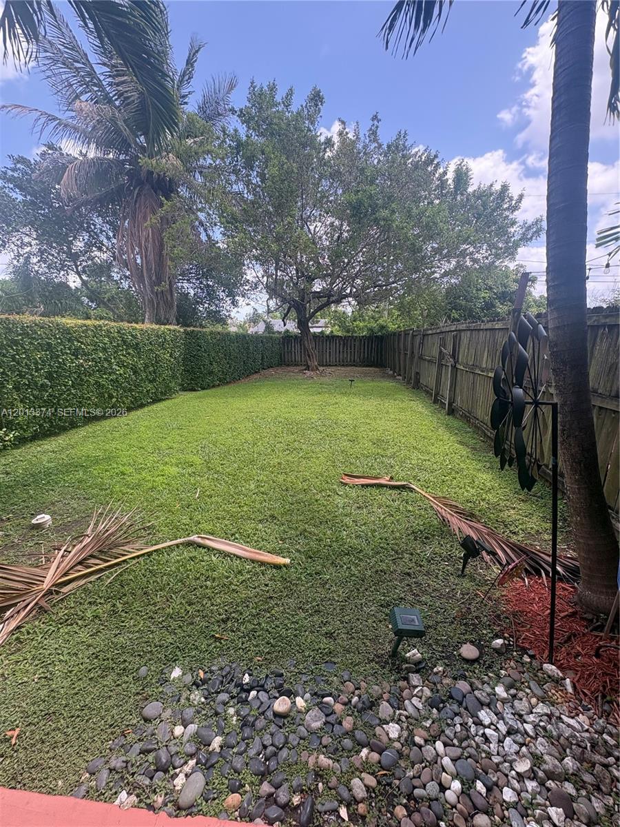 993 Northeast 3rd Avenue Homestead, FL 33030 - Photo 16 of 16 a view of a field with a tree