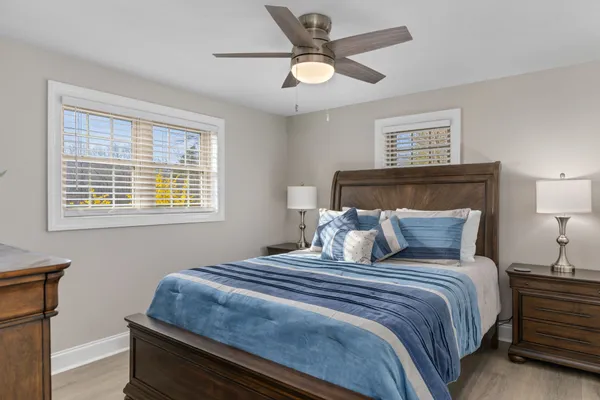 a bedroom with a large bed and a window