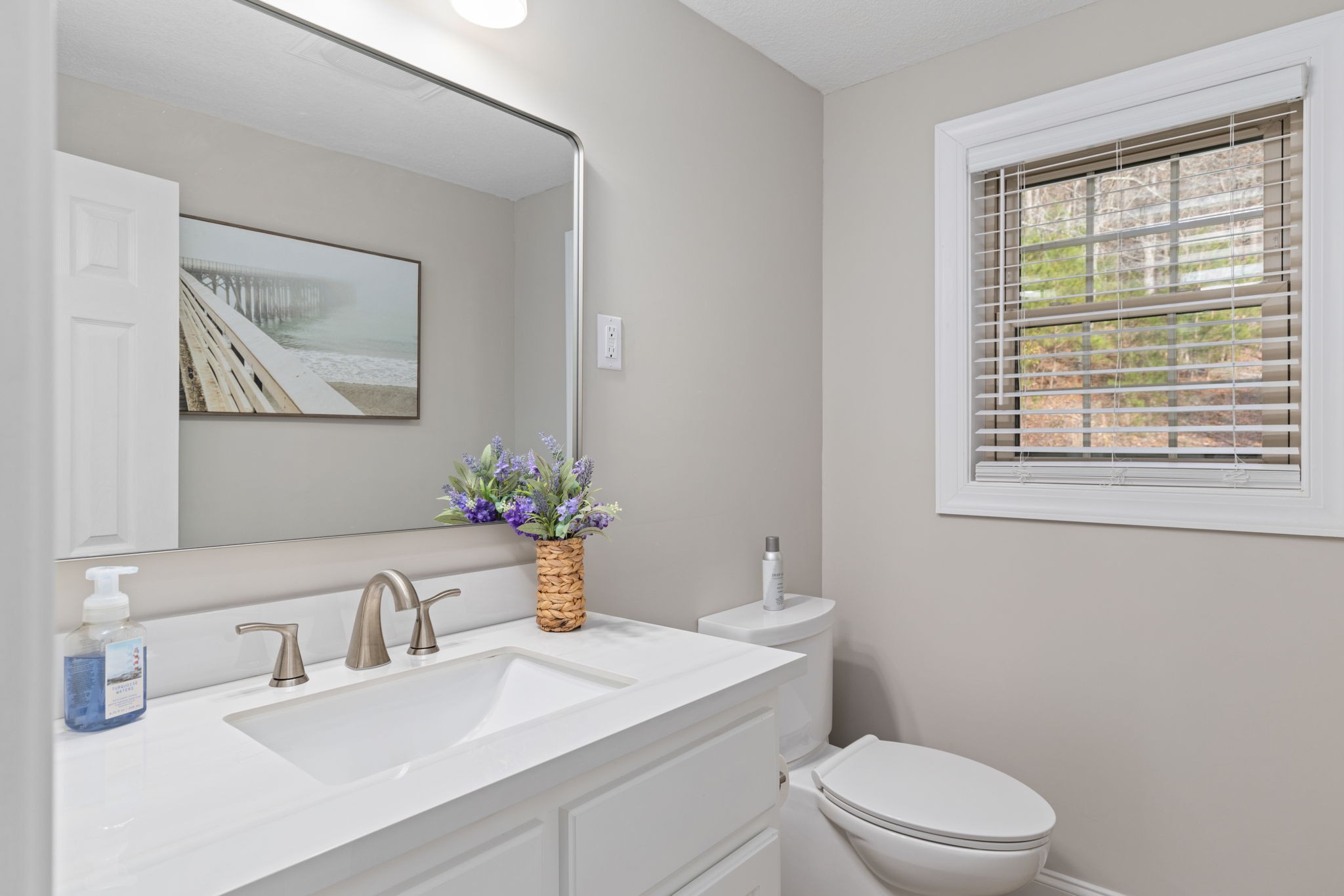 5685 County Road 14 Waterloo, AL 35677 - Photo 17 of 26 a bathroom with a sink a toilet and a window