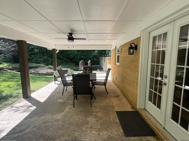 5685 County Road 14 Waterloo, AL 35677 - Photo 18 of 26 a dining room with furniture and a floor to ceiling window