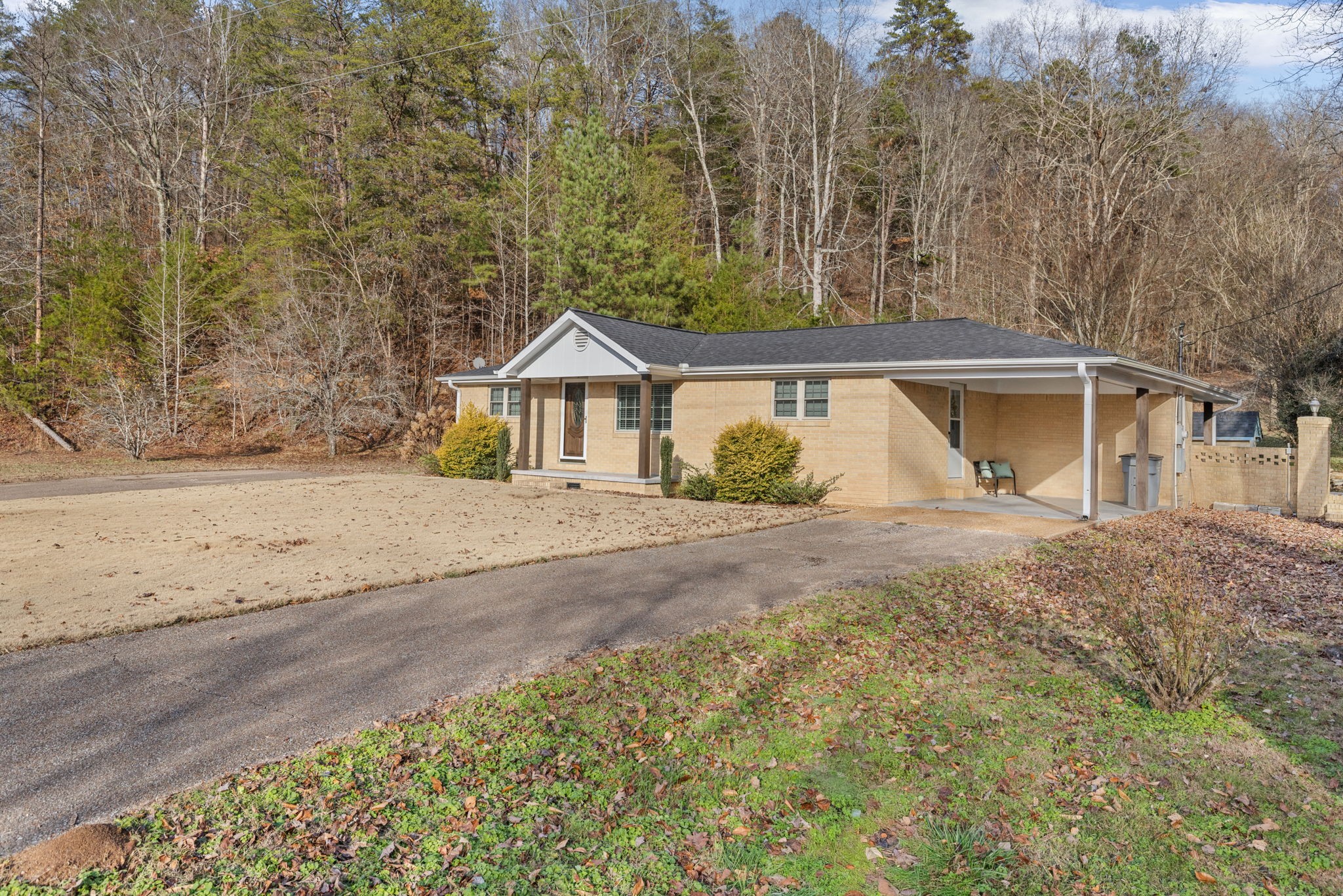 5685 County Road 14 Waterloo, AL 35677 - Photo 3 of 26 a front view of a house with a yard and trees