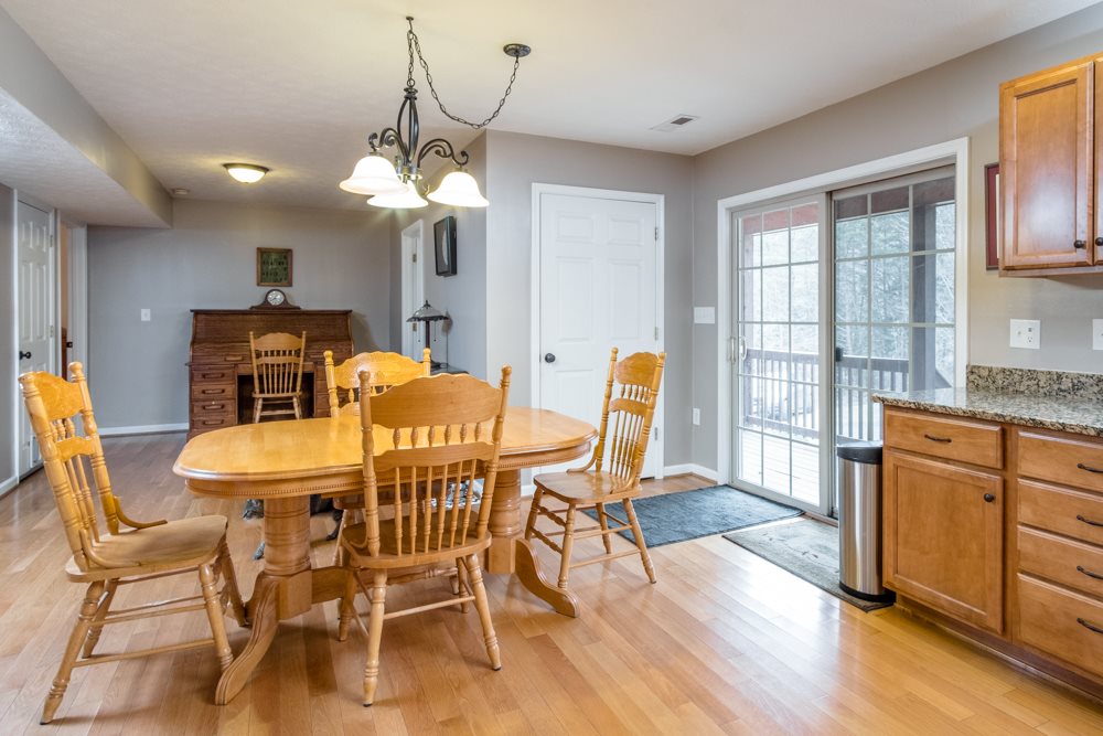 194 Hupman Road Churchville, VA 24421 - Photo 10 of 35 a dining room with furniture a chandelier and wooden floor