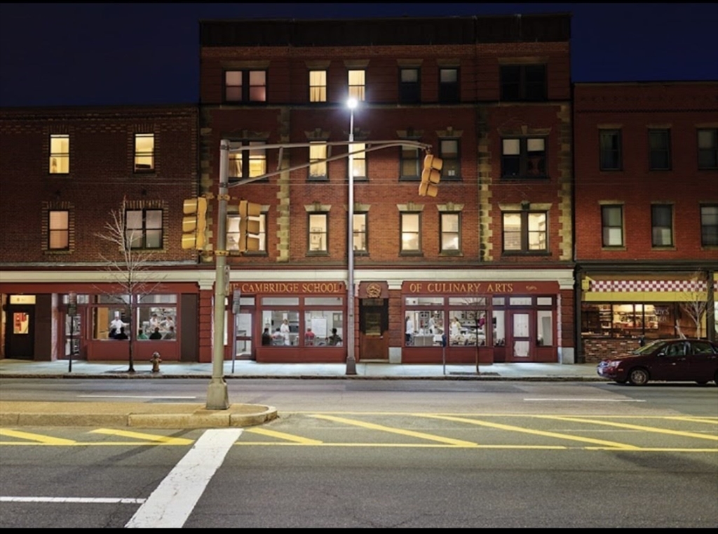 2020 Massachusetts Avenue, Unit 1 Cambridge, MA 02140 - Photo 1 of 11 a view of a building with a swimming pool