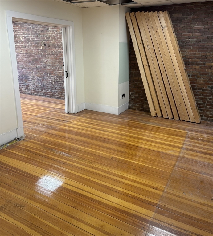 2020 Massachusetts Avenue, Unit 1 Cambridge, MA 02140 - Photo 4 of 11 a view of wooden floor with a sink
