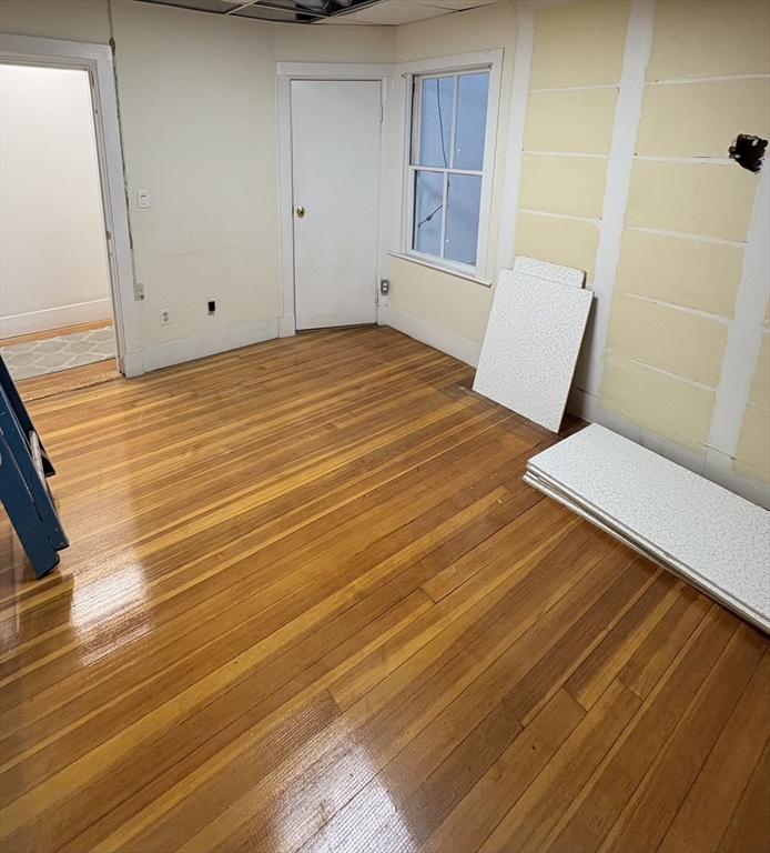 2020 Massachusetts Avenue, Unit 1 Cambridge, MA 02140 - Photo 5 of 11 a view of a room with wooden floor and staircase