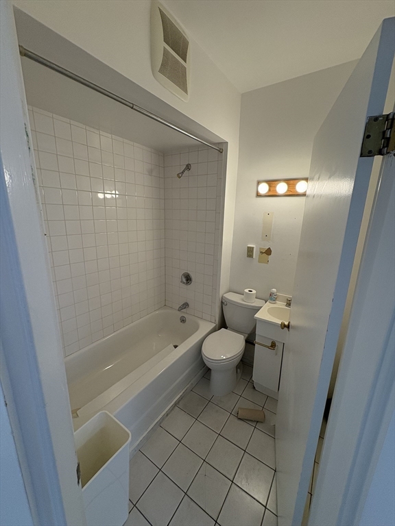 2020 Massachusetts Avenue, Unit 1 Cambridge, MA 02140 - Photo 9 of 11 a bathroom with a sink a toilet and shower