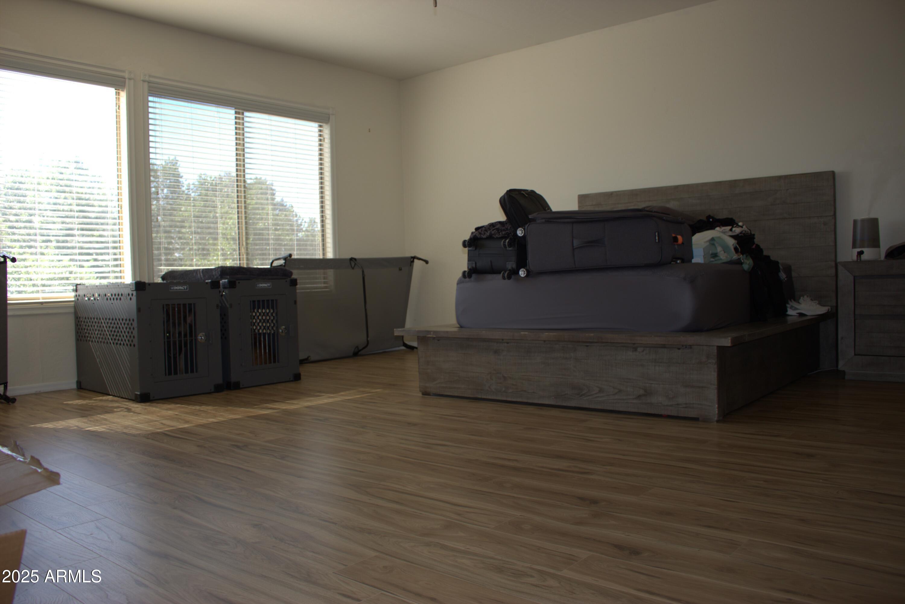 1433 West Longhorn Drive Chandler, AZ 85286 - Photo 15 of 27 a living room with furniture and wooden floor