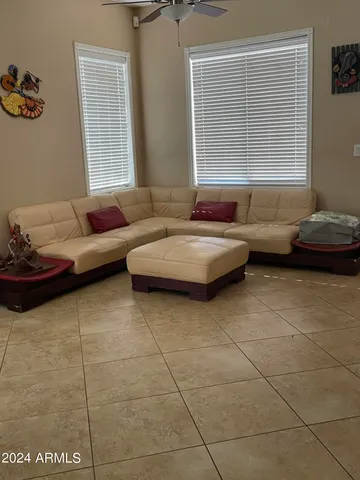 a living room with furniture and a window