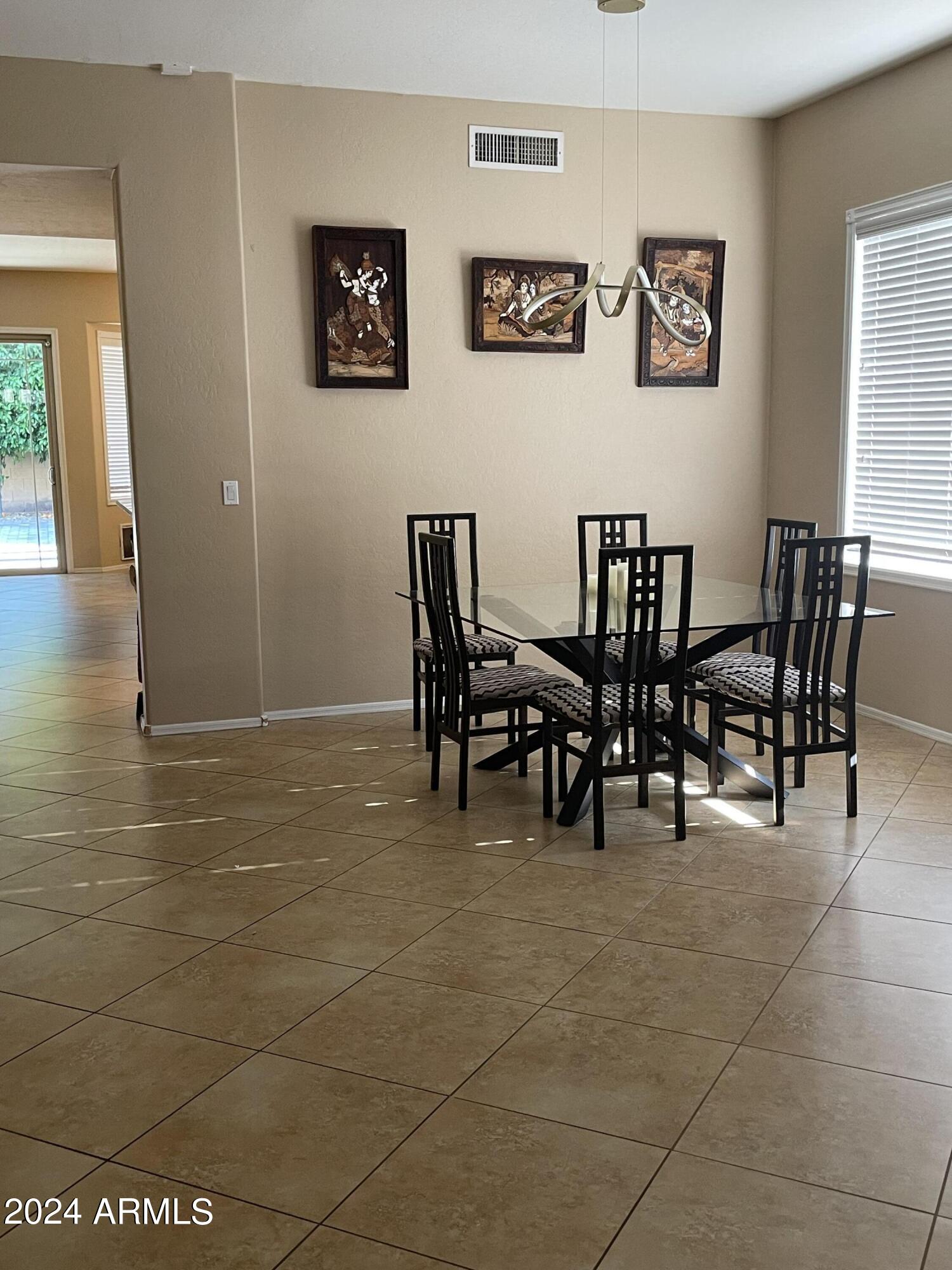 1433 West Longhorn Drive Chandler, AZ 85286 - Photo 3 of 27 a view of a dining room with furniture