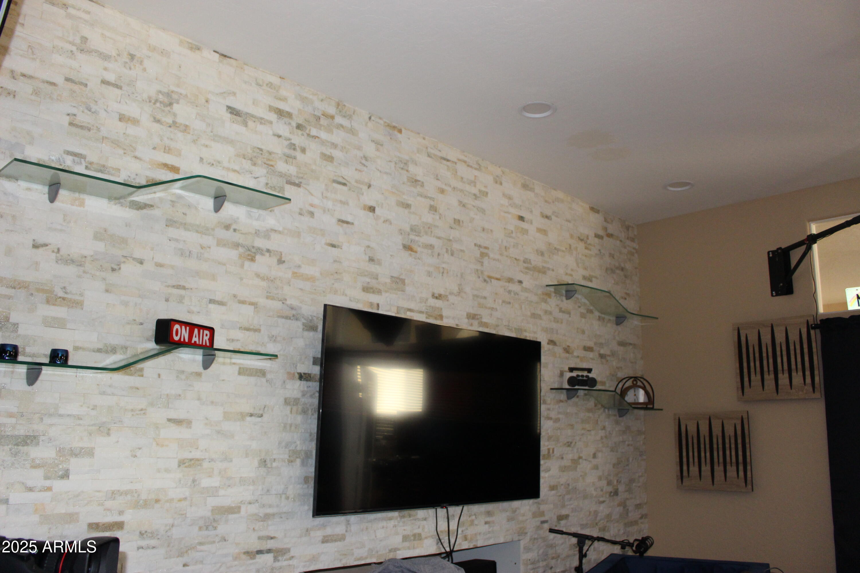 1433 West Longhorn Drive Chandler, AZ 85286 - Photo 5 of 27 a living room with a flat screen tv and a fireplace