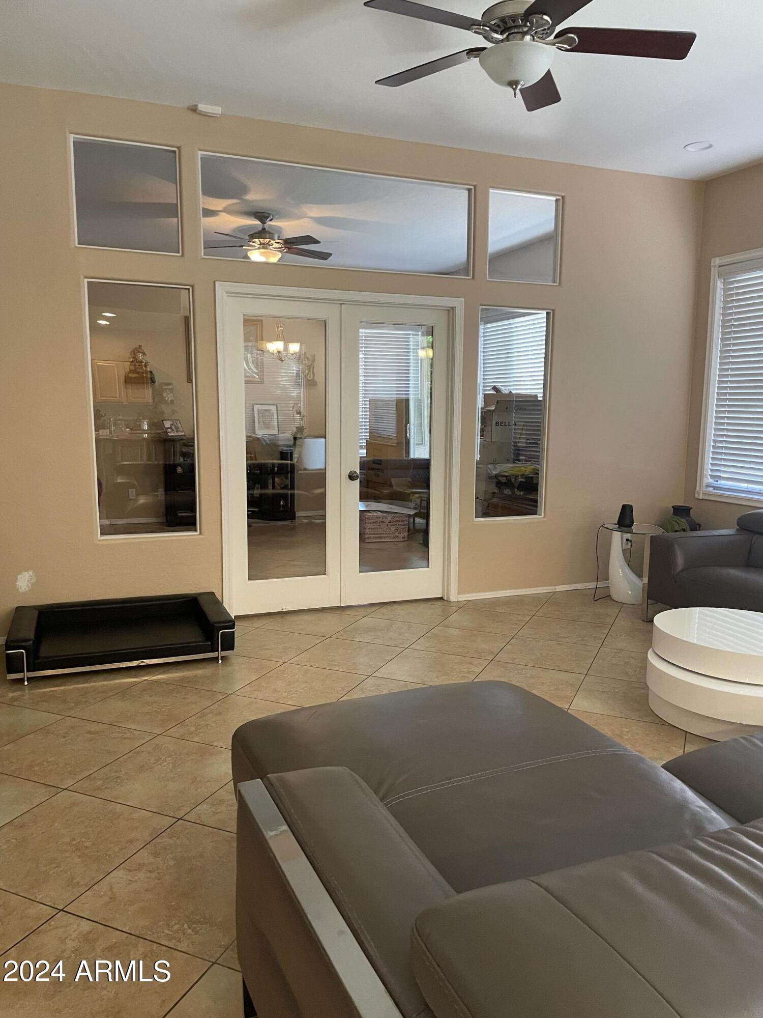 1433 West Longhorn Drive Chandler, AZ 85286 - Photo 7 of 27 a living room with furniture and a large window