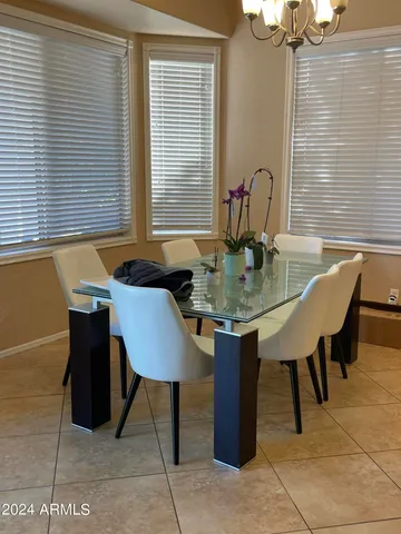 a table and chairs in a patio