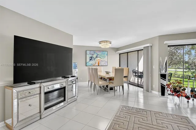 a view of a livingroom with furniture and a flat screen tv