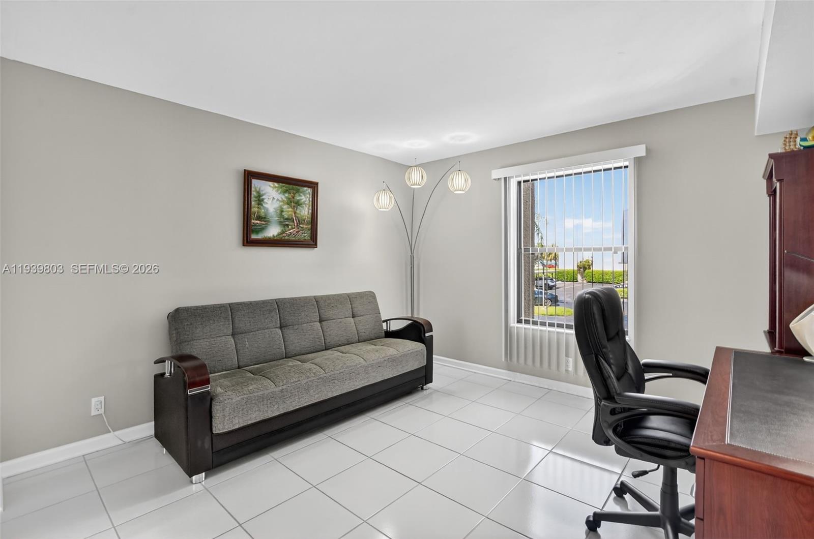 5901 Camino Del Sol, Unit 207 Boca Raton, FL 33433 - Photo 15 of 53 a living room with furniture and a flat screen tv