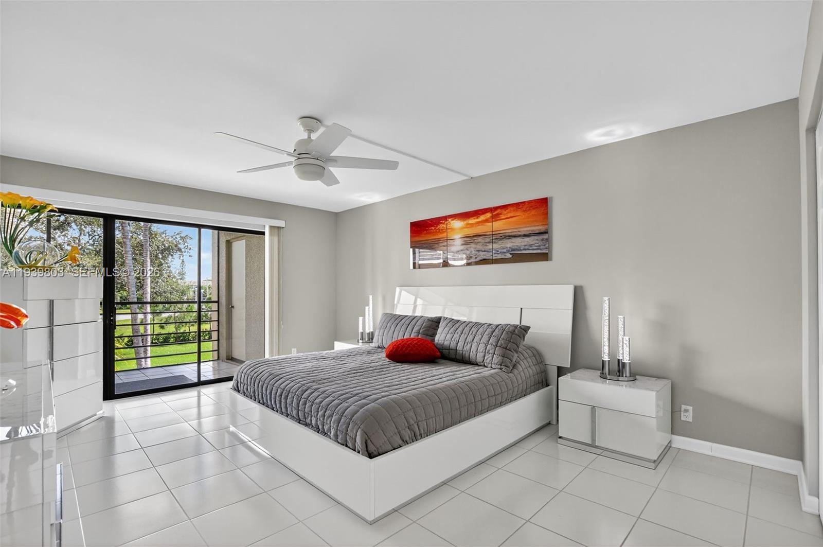 5901 Camino Del Sol, Unit 207 Boca Raton, FL 33433 - Photo 21 of 53 a bedroom with a large bed and a window