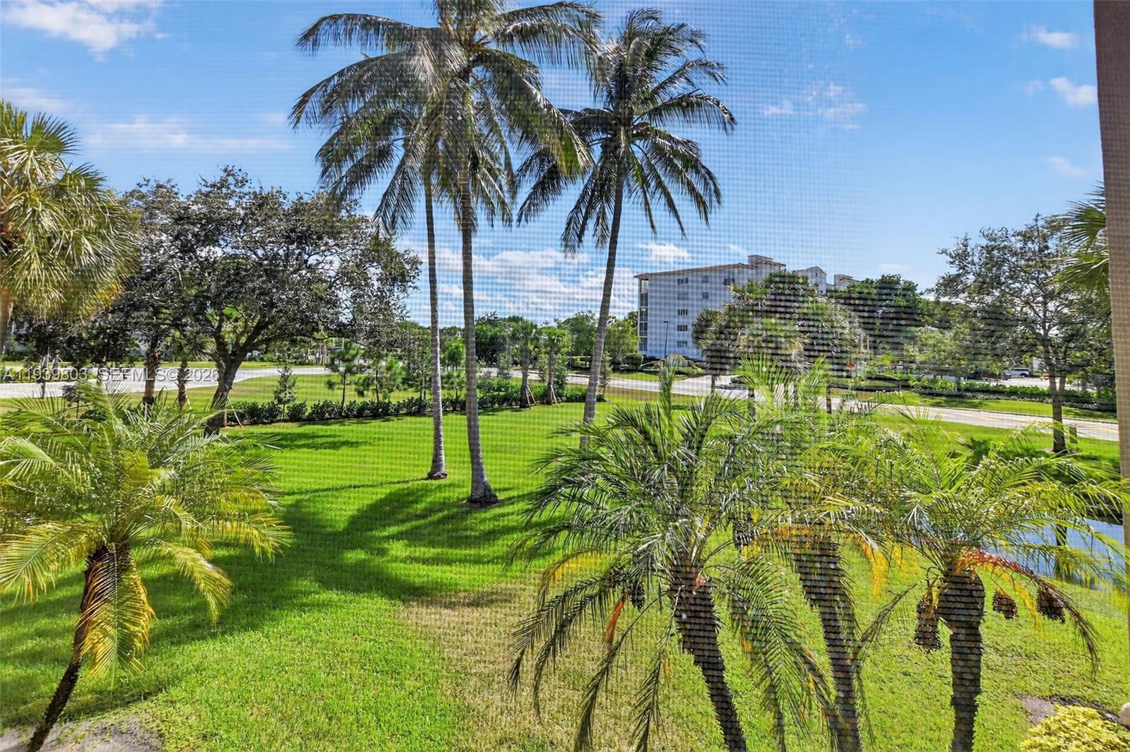 5901 Camino Del Sol, Unit 207 Boca Raton, FL 33433 - Photo 37 of 53 a view of a park with a palm tree