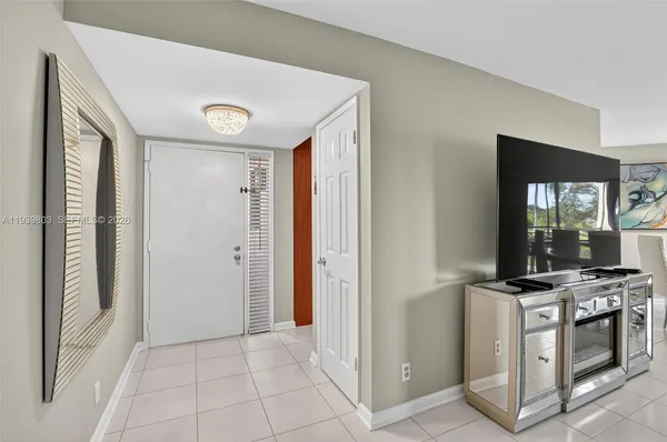 a view of a kitchen with electric appliances