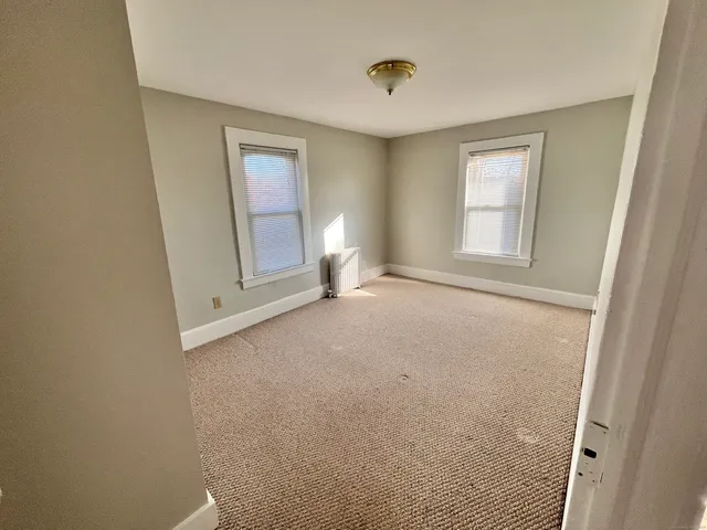 a view of empty room with front door
