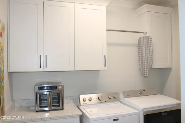 a utility room with dryer and washer