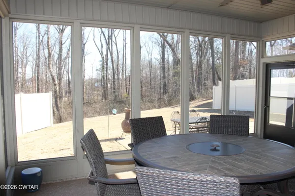 a view of a dining room with furniture window and outside view
