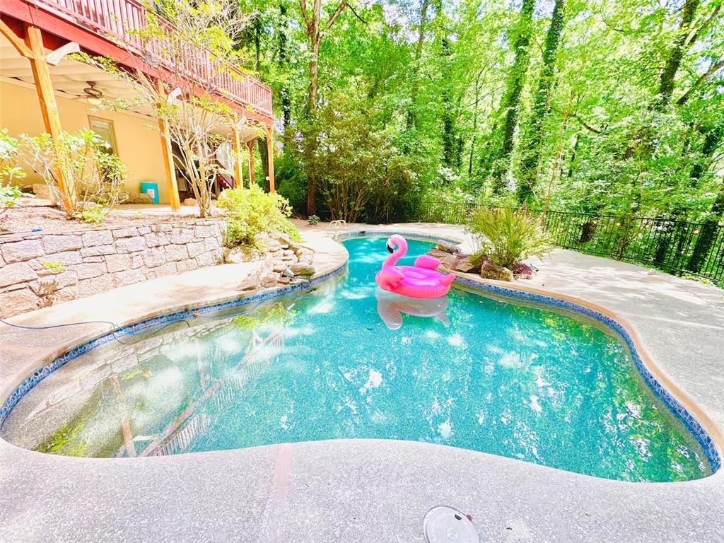 175 River Ct Parkway Atlanta, GA 30328 - Photo 12 of 50 a view of a wooden bench in backyard