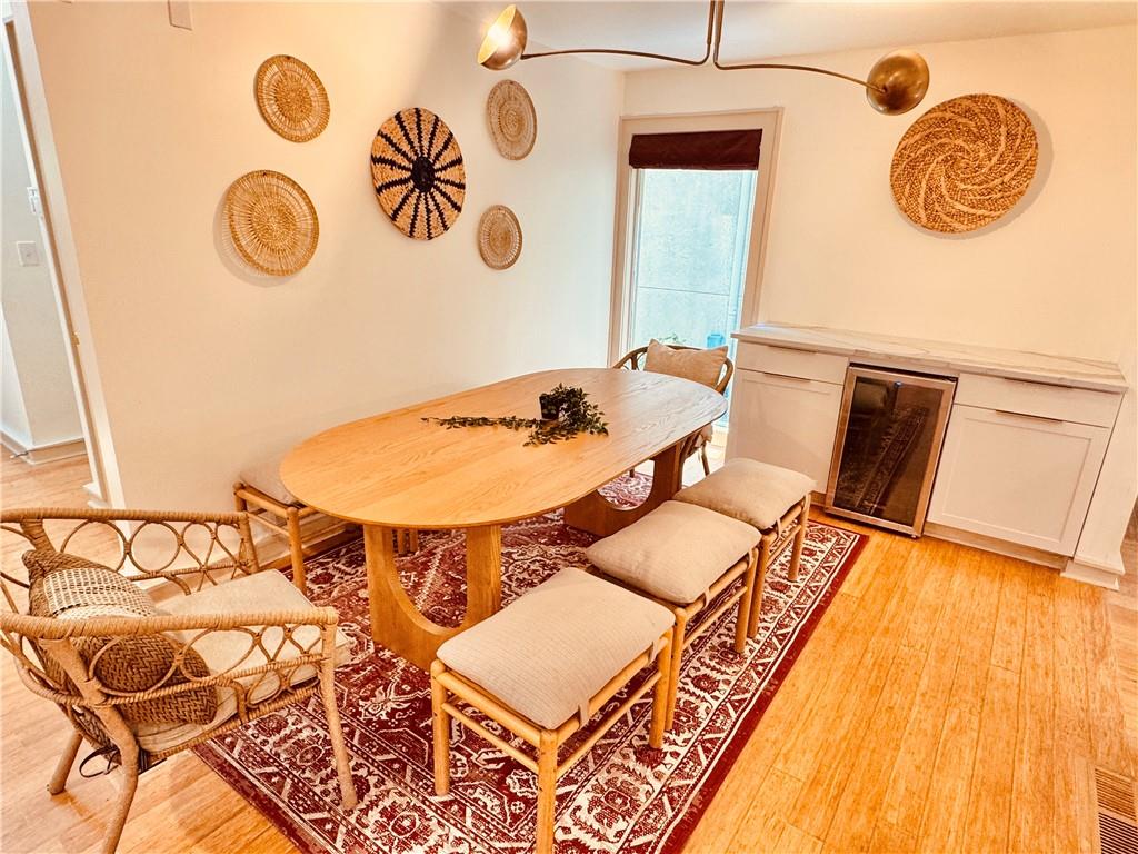 175 River Ct Parkway Atlanta, GA 30328 - Photo 14 of 50 a dining room with a rug and a wooden floor