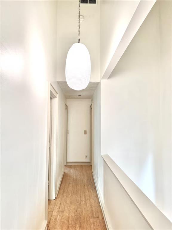 175 River Ct Parkway Atlanta, GA 30328 - Photo 20 of 50 a view of a hallway with wooden floor
