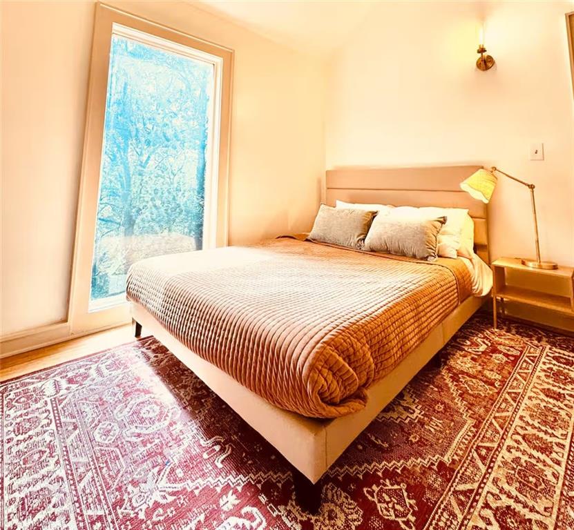 175 River Ct Parkway Atlanta, GA 30328 - Photo 30 of 50 a bedroom with a bed and a window