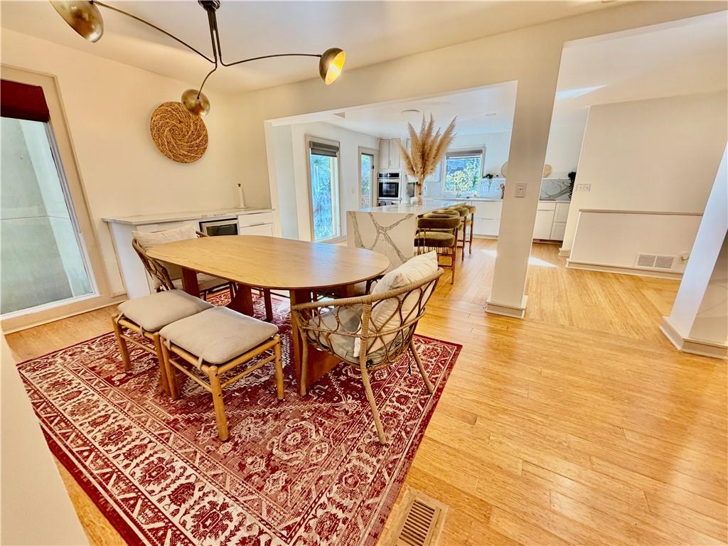 175 River Ct Parkway Atlanta, GA 30328 - Photo 5 of 50 a dining room with wooden floor and breakfast area