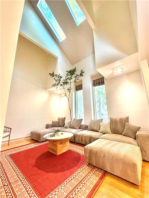 175 River Ct Parkway Atlanta, GA 30328 - Photo 9 of 50 a living room with furniture and a large window