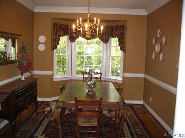 11407 Shell Harbor Chesterfield, VA 23838 - Photo 4 of 10 a view of a dining room with furniture wooden floor and chandelier