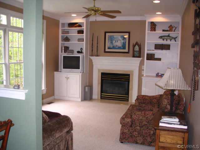11407 Shell Harbor Chesterfield, VA 23838 - Photo 5 of 10 a living room with furniture a fireplace and a window