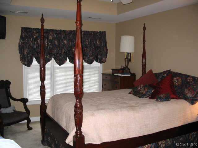 11407 Shell Harbor Chesterfield, VA 23838 - Photo 6 of 10 a bedroom with a bed a mirror and lamp on desk