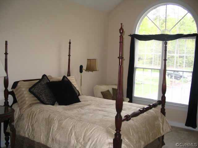 11407 Shell Harbor Chesterfield, VA 23838 - Photo 7 of 10 a bedroom with a bed window and a chandelier