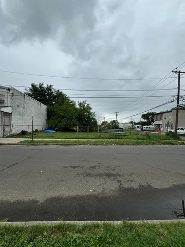 a view of a garden with a building