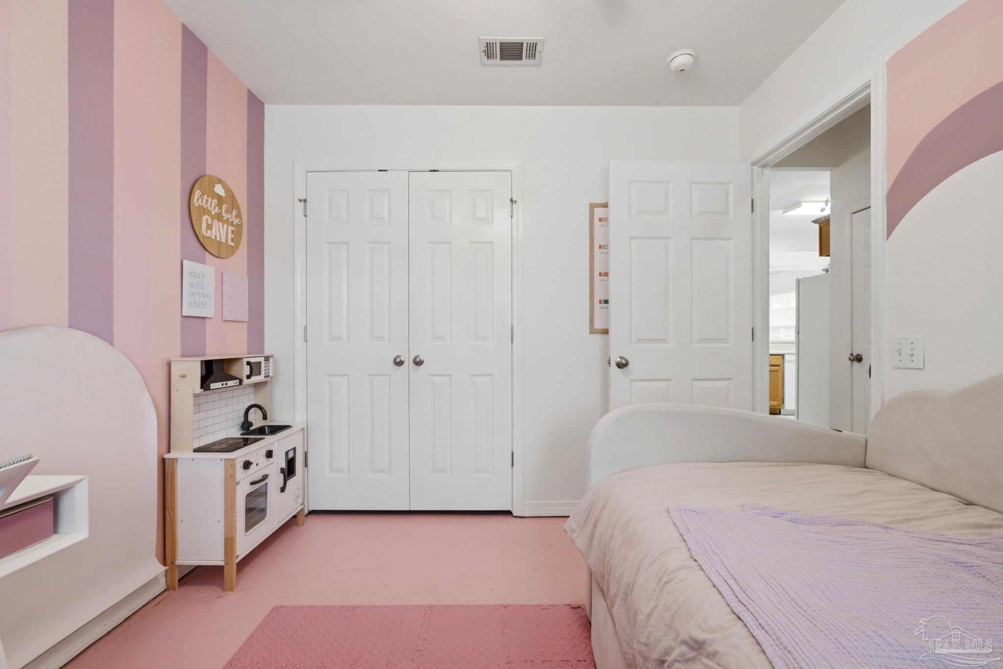 1237 Brownfield Road Pensacola, FL 32526 - Photo 4 of 30 a bedroom with a bed and a window